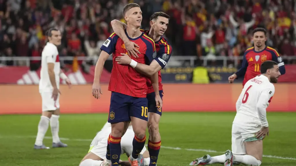Spain seals its qualification for the World Cup with a 2-2 draw against Turkey