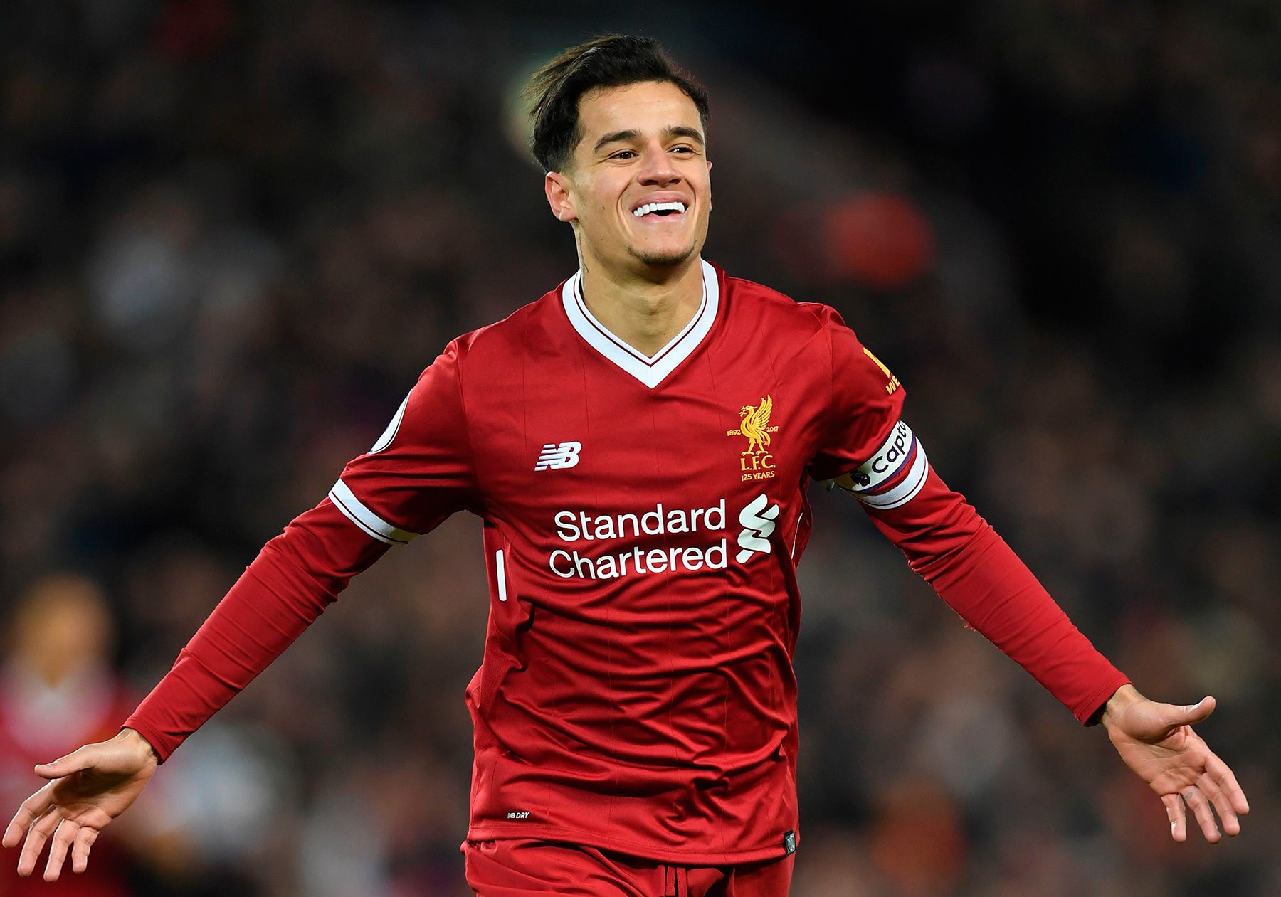 Coutinho celebrates a goal with Liverpool