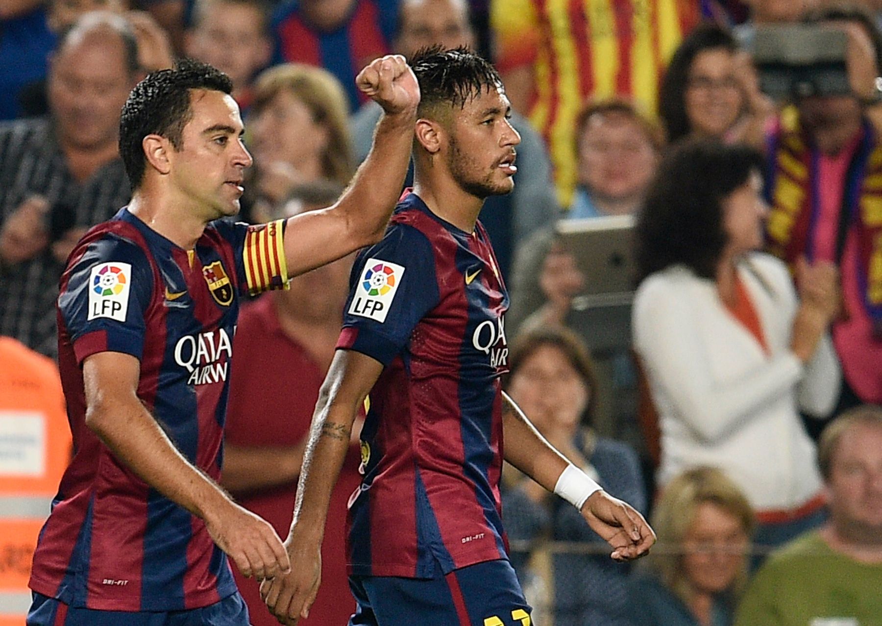 Xavi and Neymar celebrating a goal from FC Barcelona