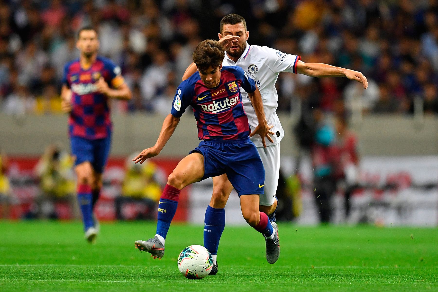 Riqui Puig in the match against Chelsea with Kovacic