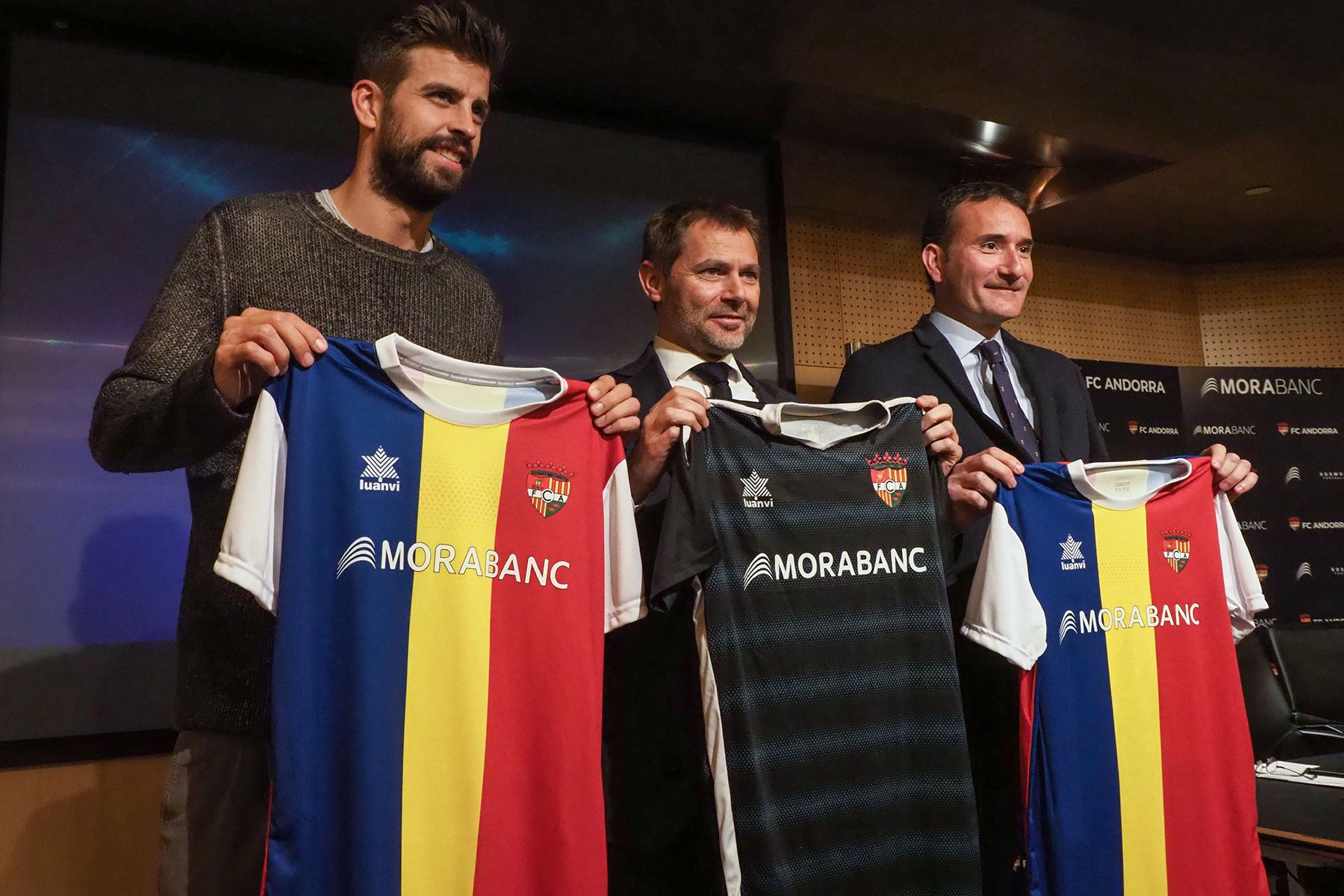 Gerard Piqué, owner of Andorra, poses with his shirt