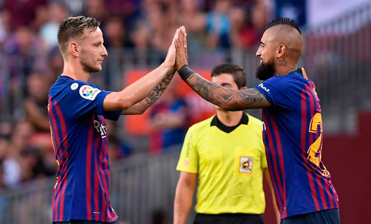 Ivan Rakitic and Arturo Vidal, during a match