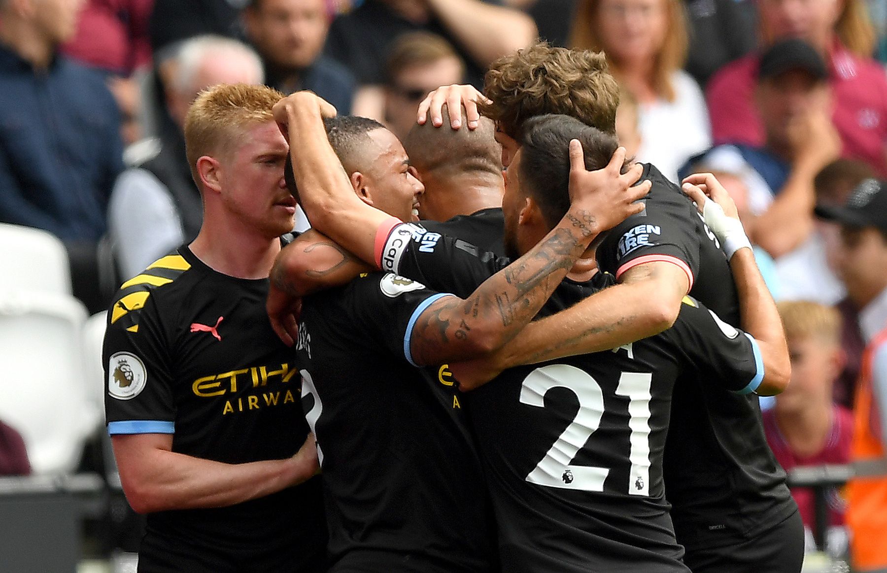 Manchester City players celebrate a goal against West Ham