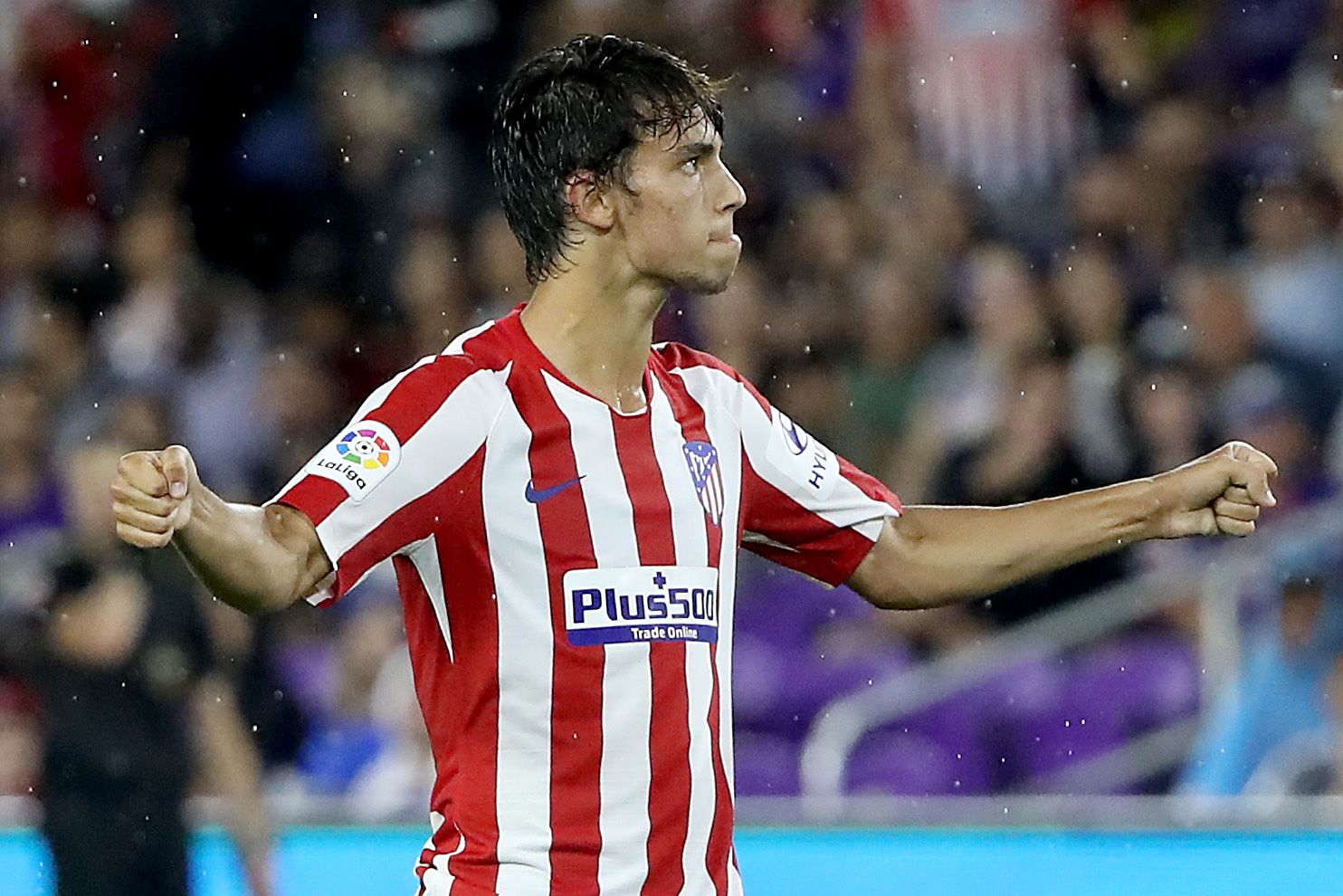 Joao Felix celebrates a goal with Atlético in preseason