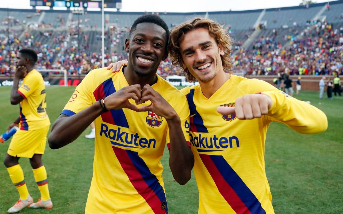 Dembélé and Griezmann, smiling after scoring against Napoli