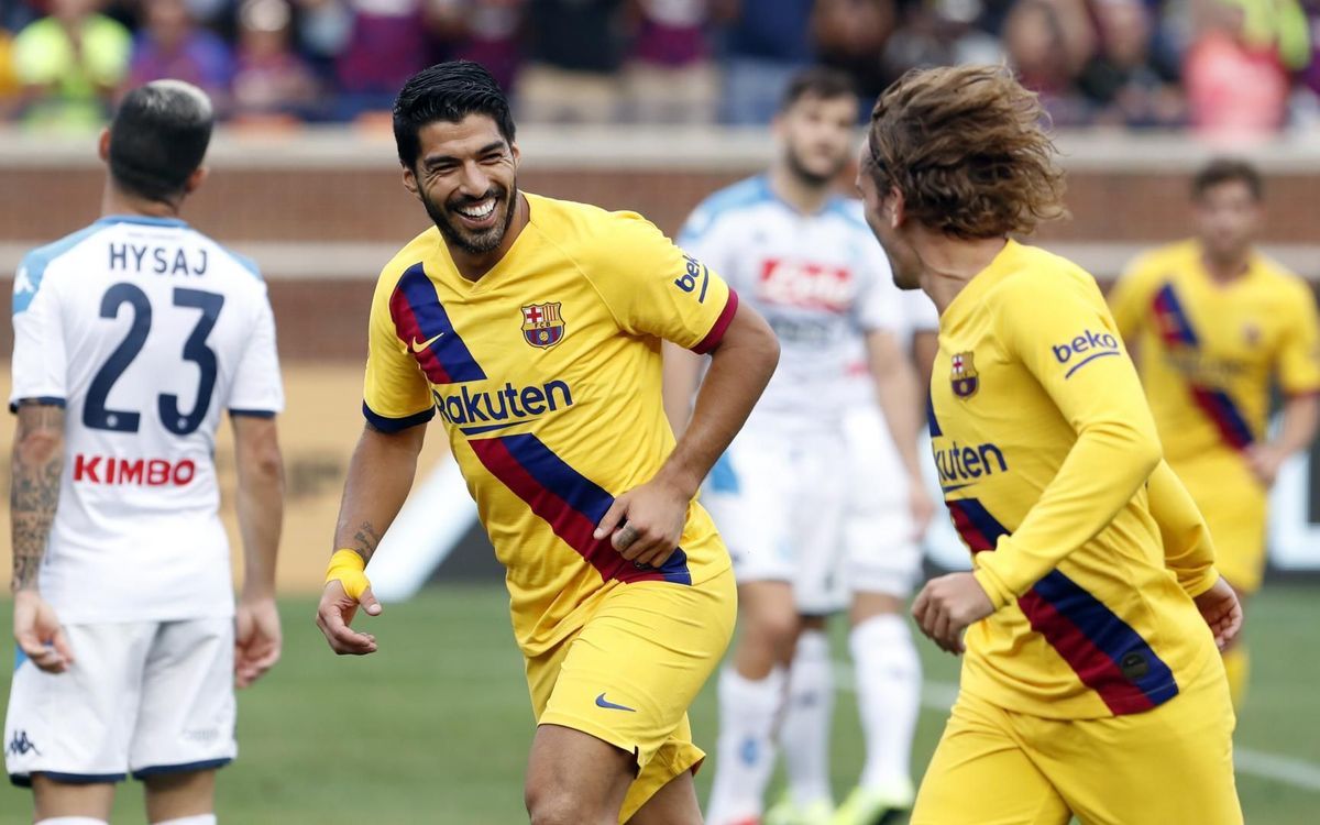 Luis Suárez and Antoine Griezmann, celebrating a goal against Napoli