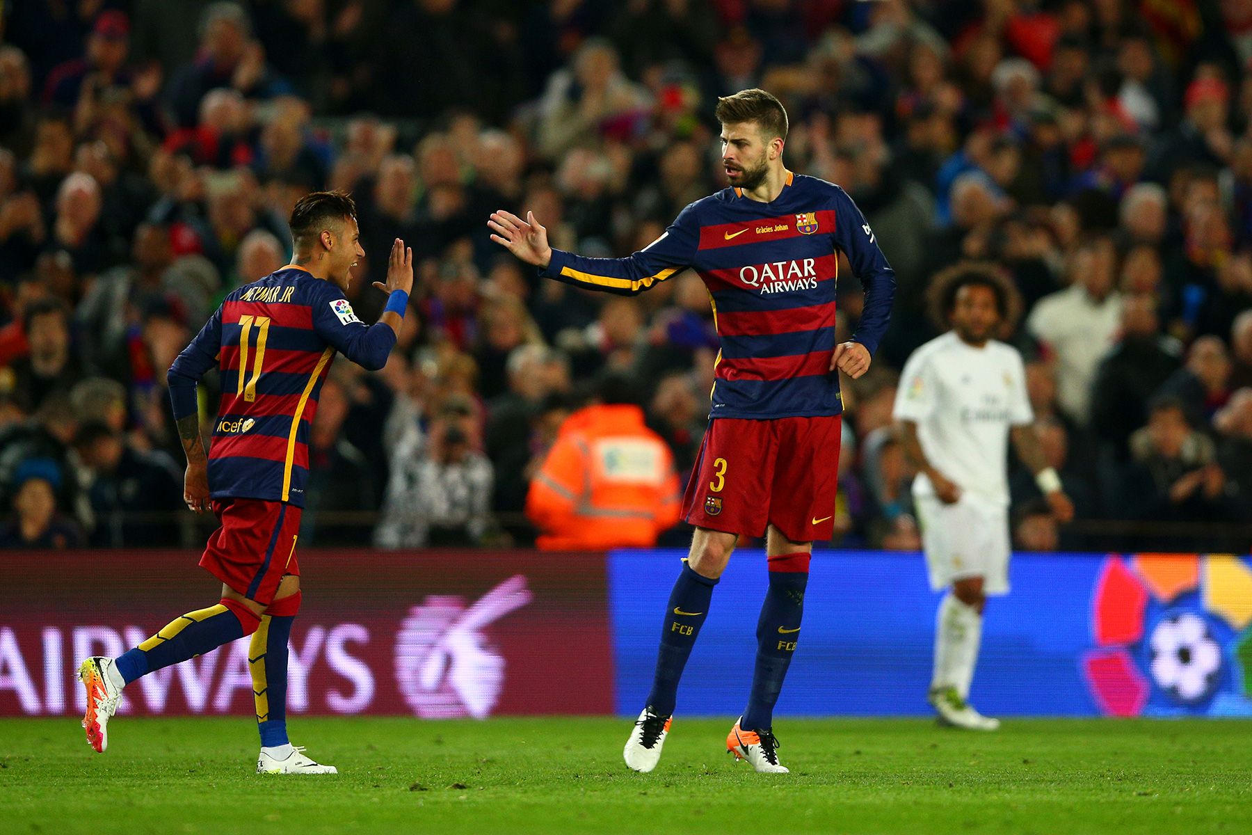 Neymar and Pique celebrate a goal with Barcelona