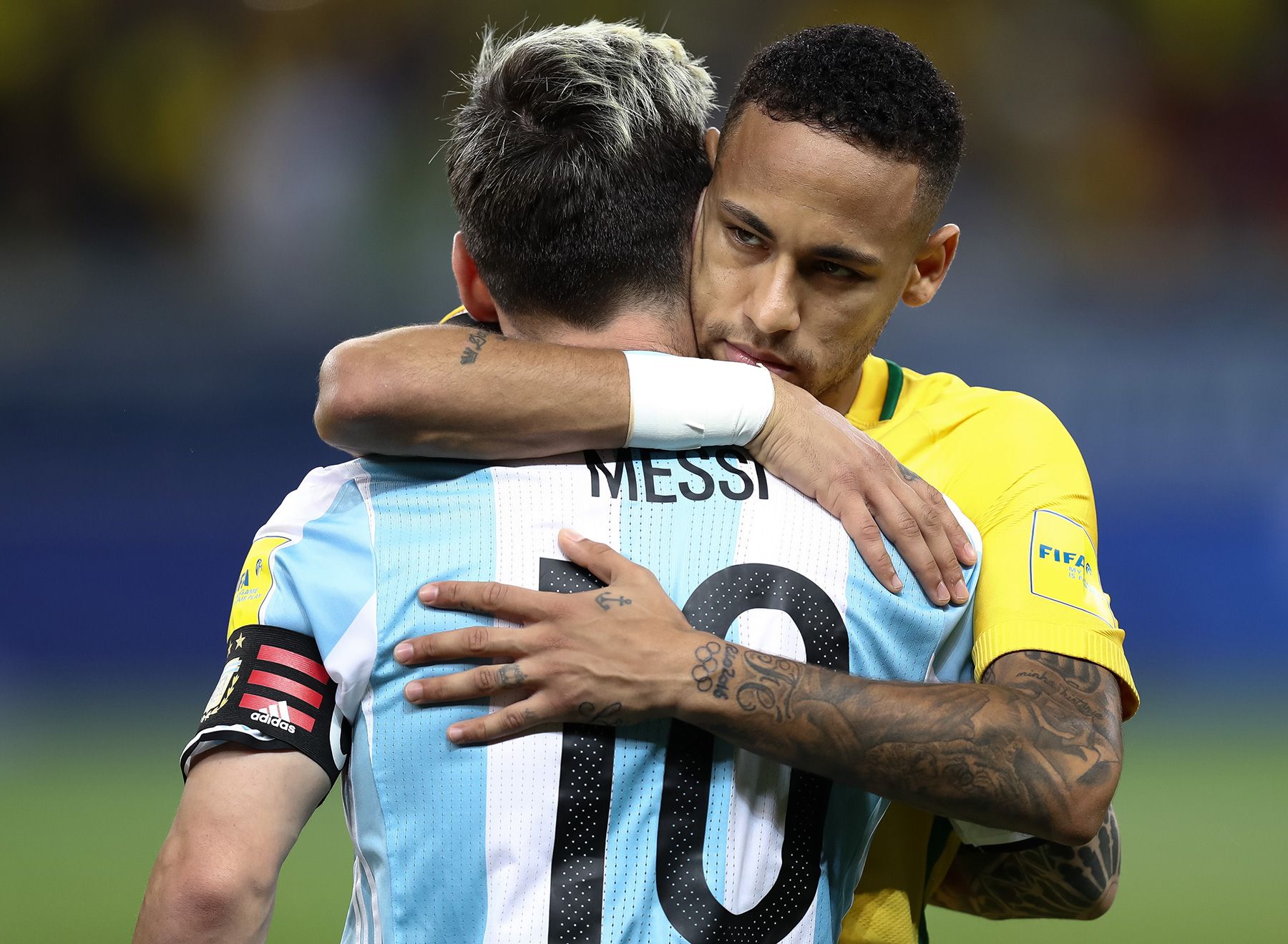 Neymar and Messi hug in a national team match