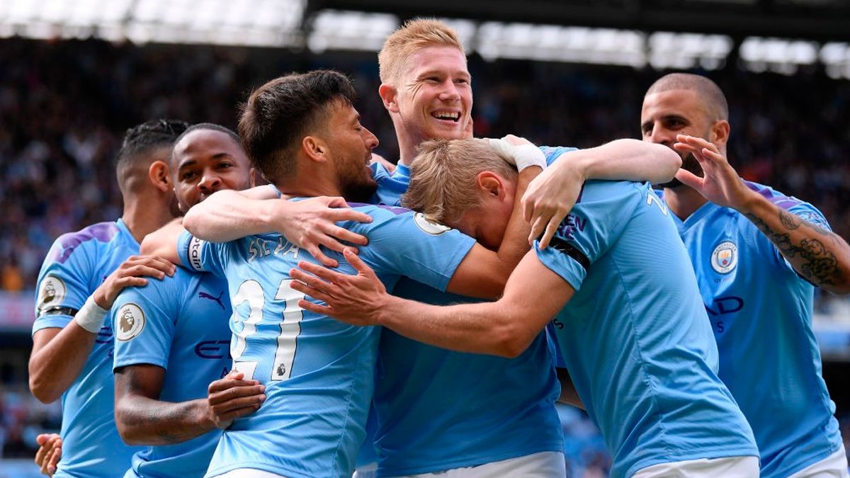 The players of Manchester City celebrate a goal in the Premier League