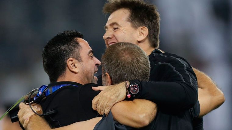 Xavi Hernández and his assistants celebrate a win of Al-Sadd