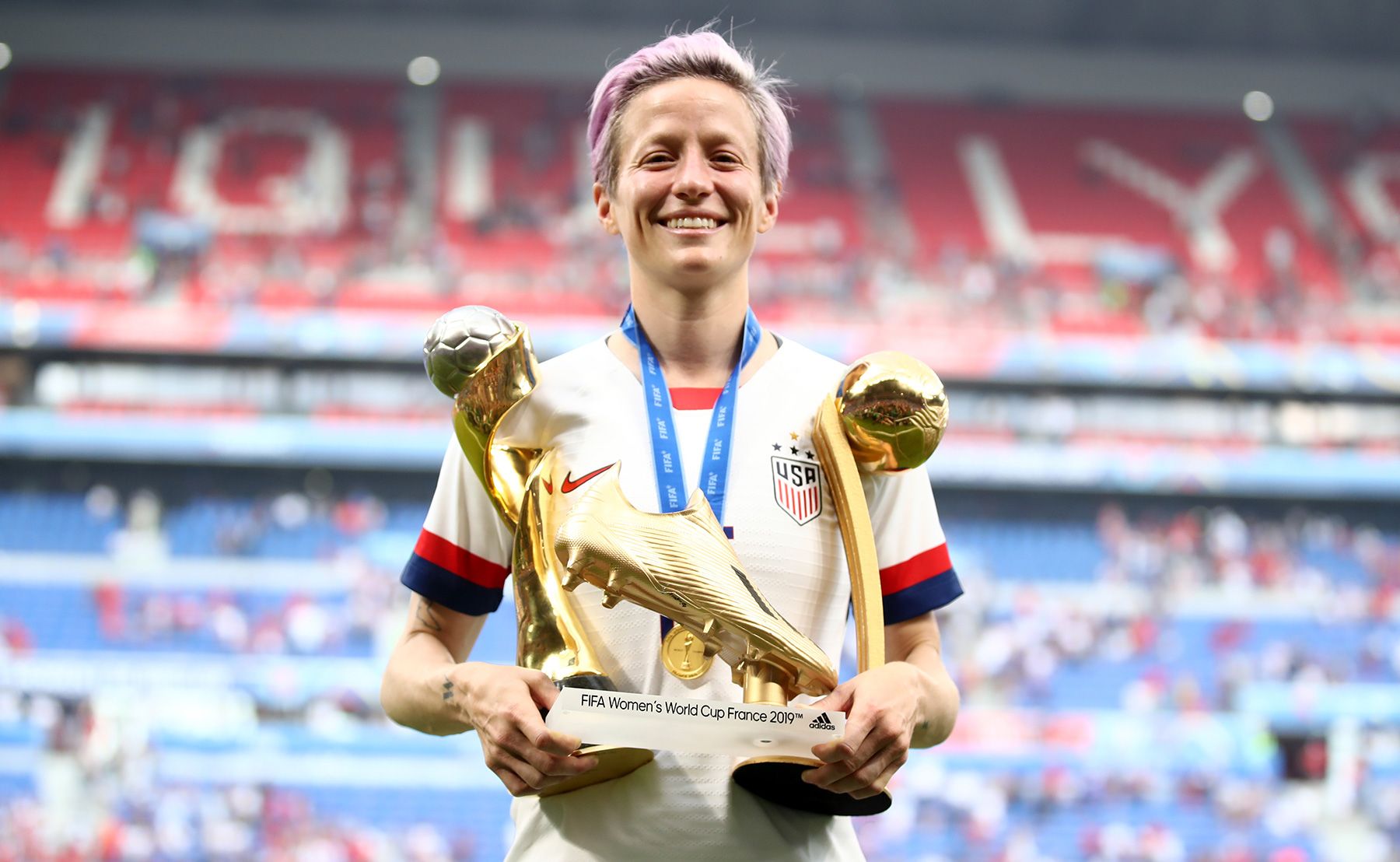 Megan Rapinoe poses with his prizes in the World-wide