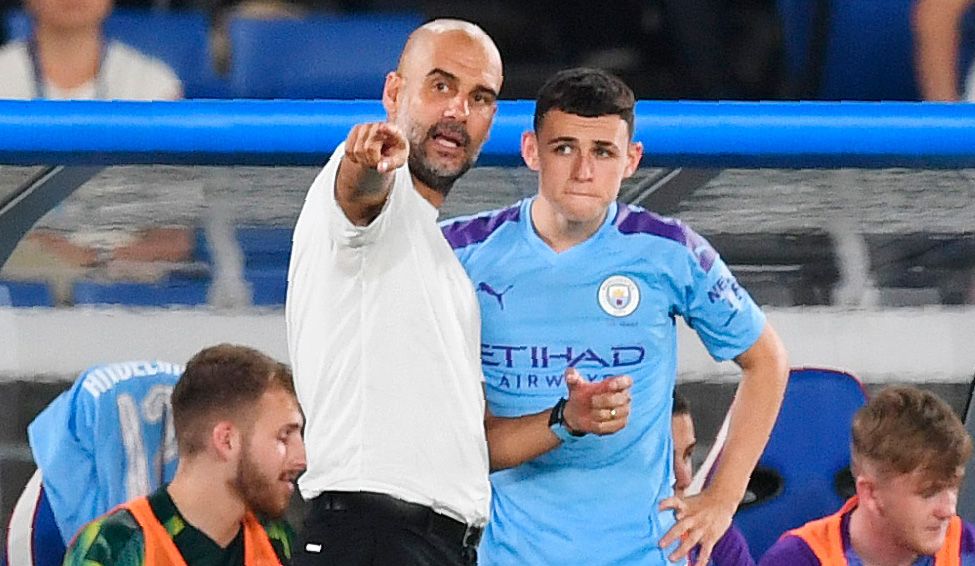 Phil Foden And Pep Guardiola in the bench of the City