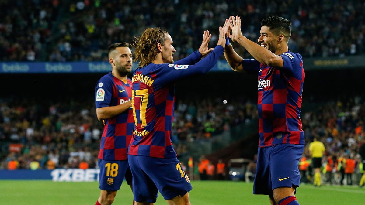 Antoine Griezmann y Luis Suárez celebran un gol del Barça