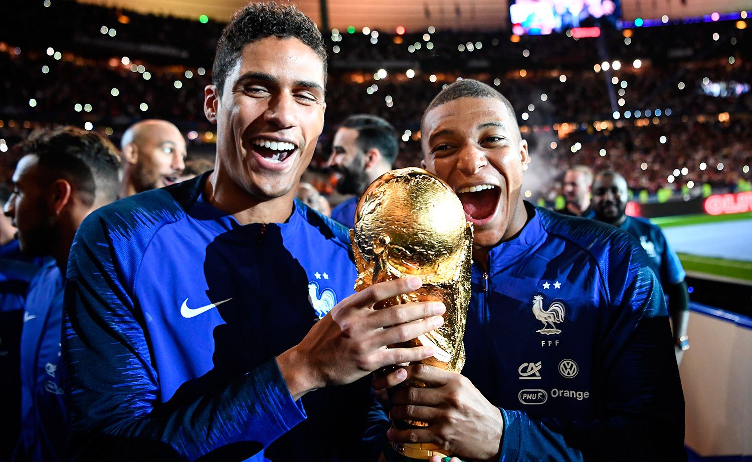 Raphael Varane and Kylian Mbappé, with the Glass of the World