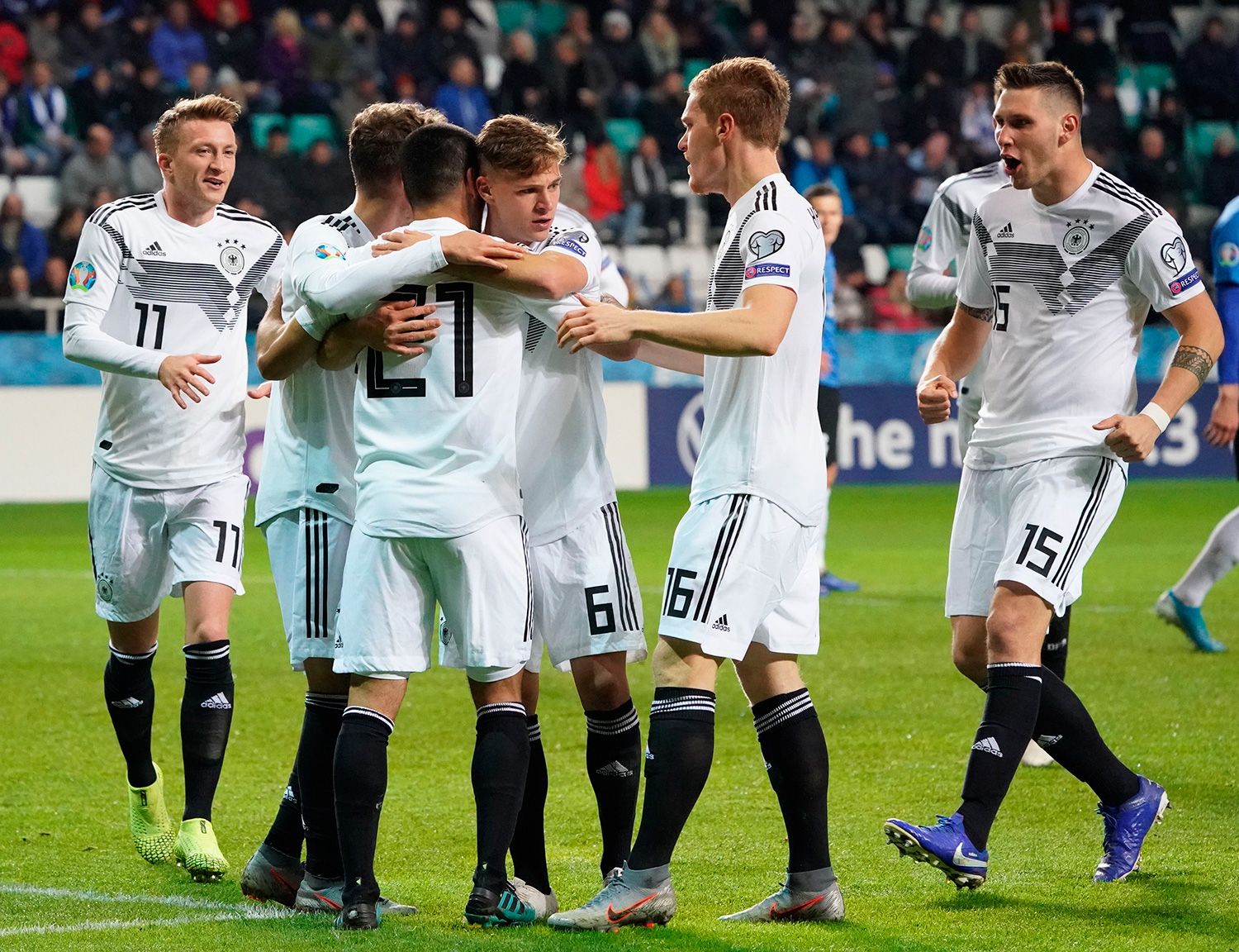 The players of Germany celebrate a goal against Estonia
