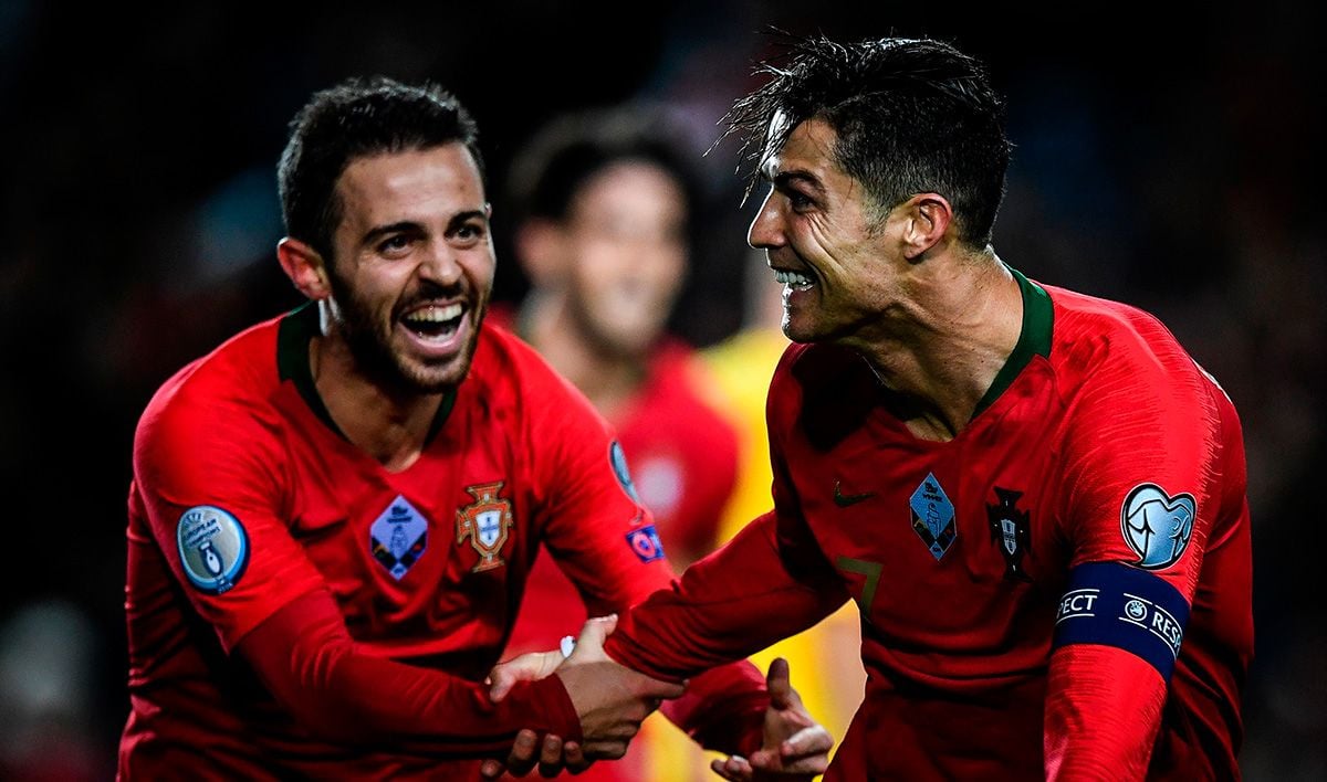 Cristiano Ronaldo and Bernardo Silva, celebrating a goal with Portugal
