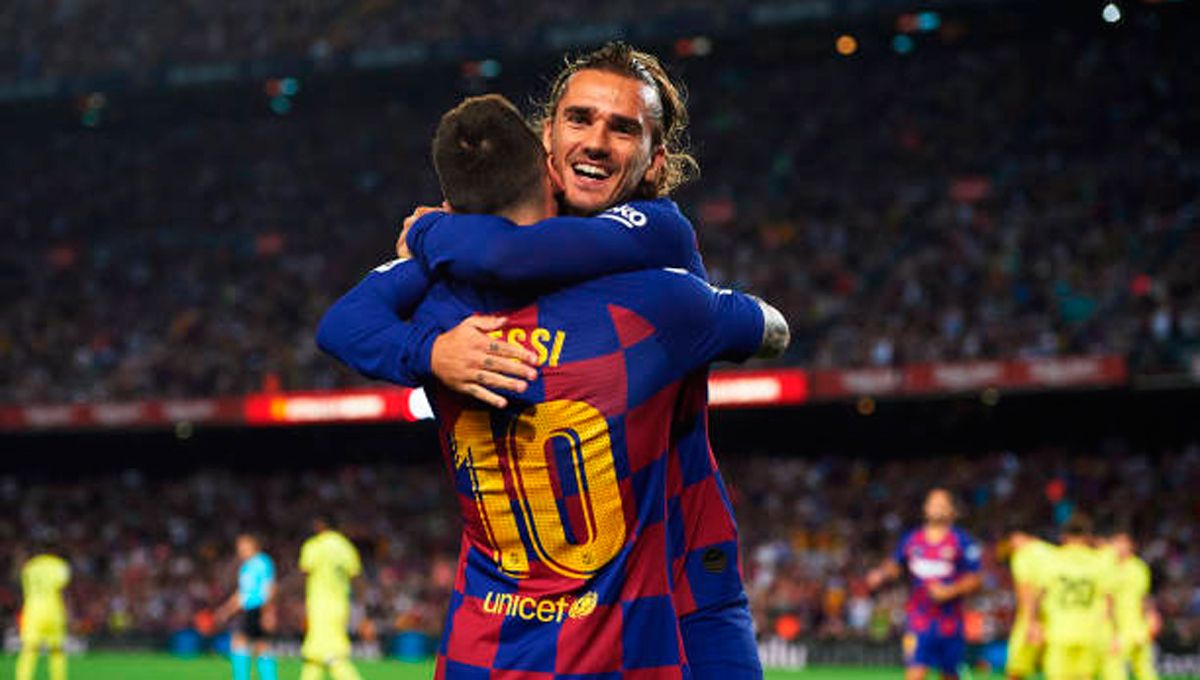 Leo Messi, celebrating a goal with Griezmann