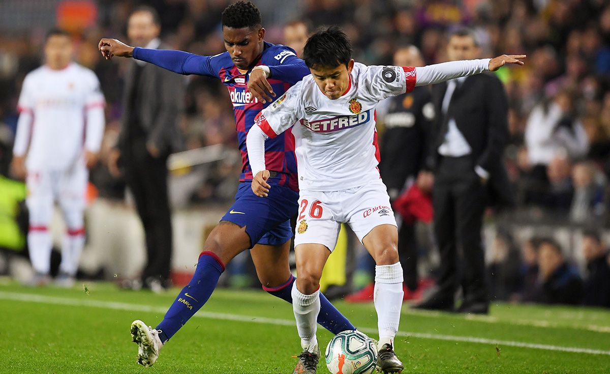 Takefusa Kubo, trying leave away from Junior Firpo in the Camp Nou