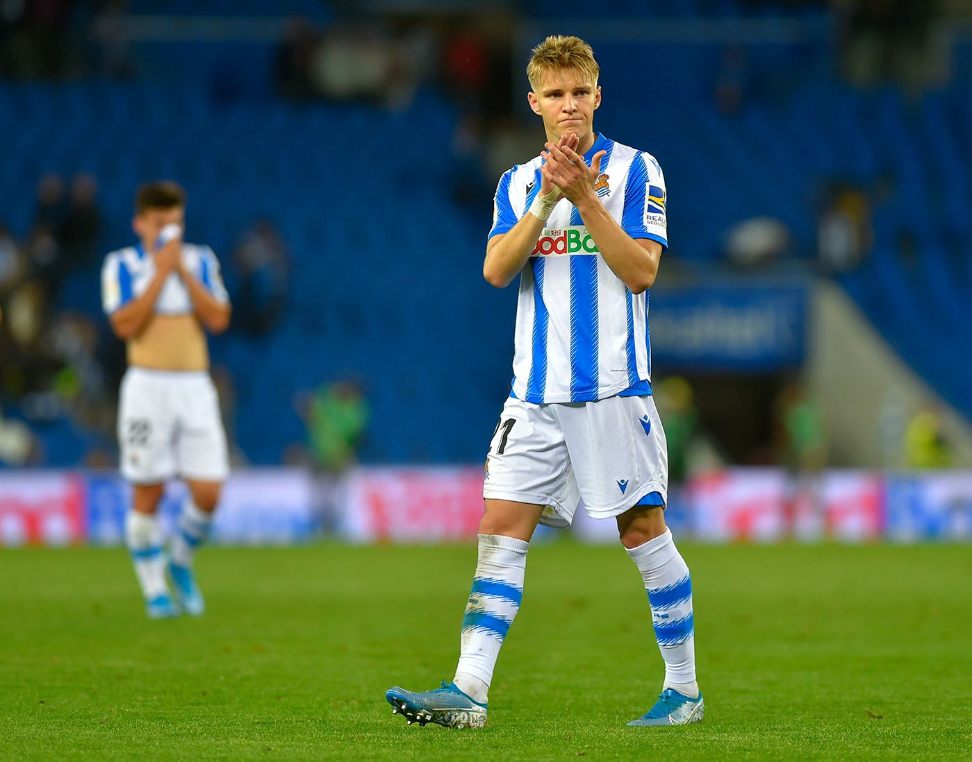 Martin Odegaard applauds after a party