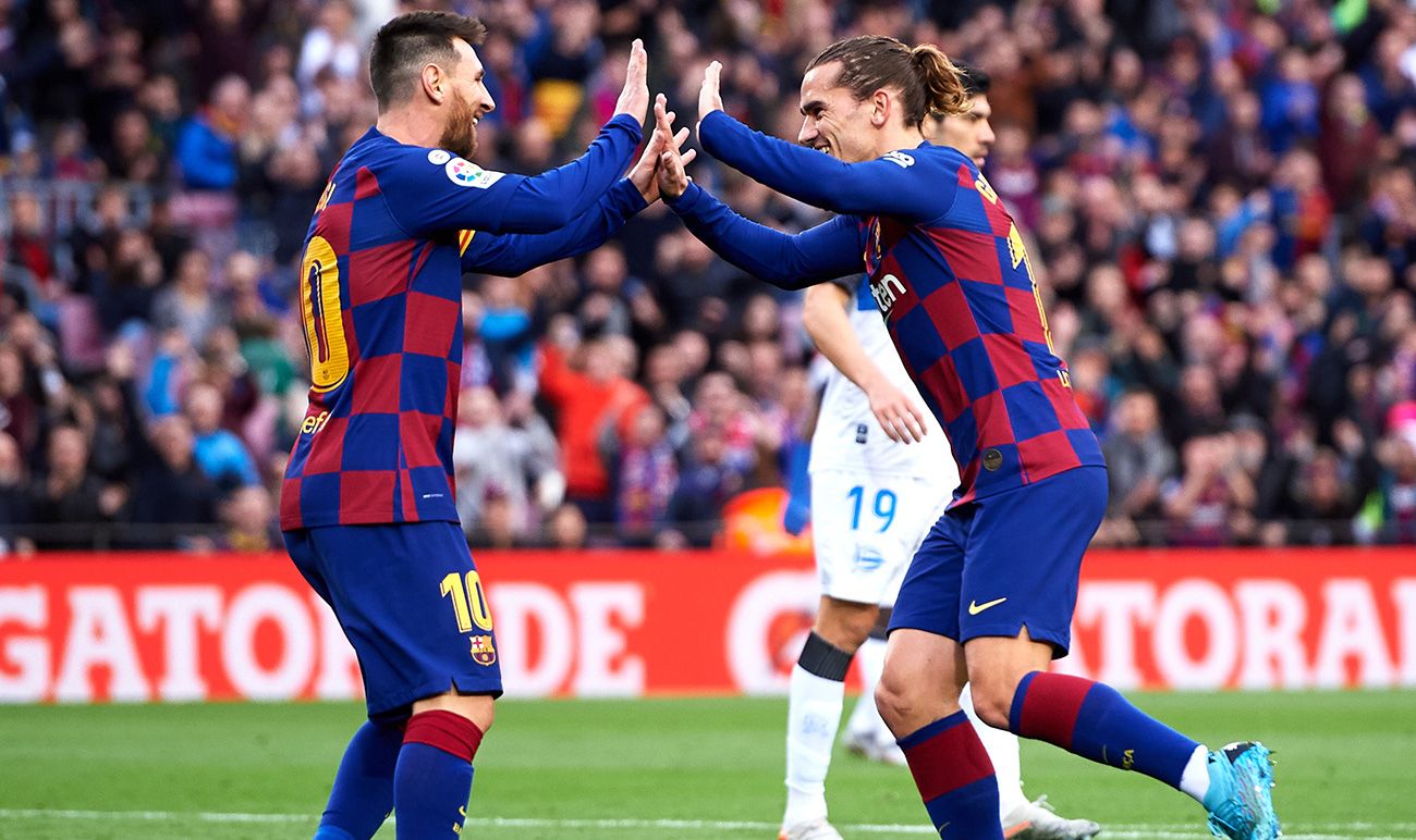 Griezmann And Messi celebrate a goal against the Alavés