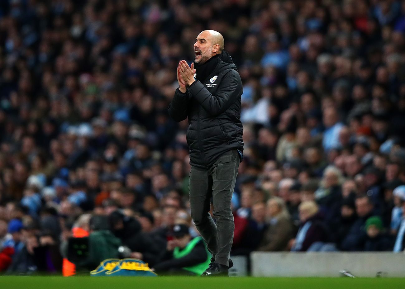 Pep Guardiola encourages to his players in a party