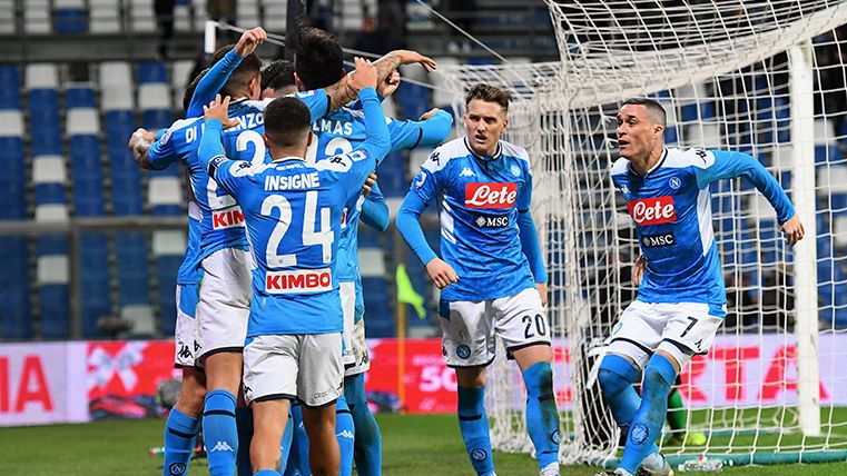The players of Napoli celebrate a goal in the Serie A