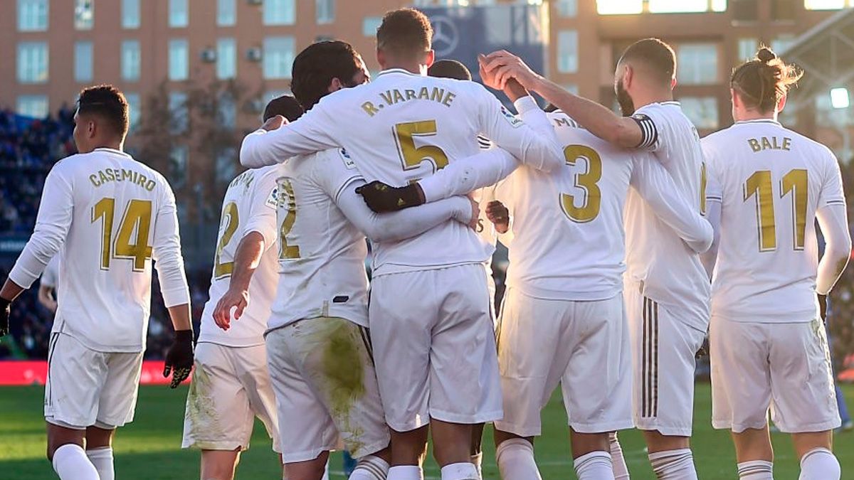 Raphaël Varane celebrates a goal with Real Madrid in LaLiga