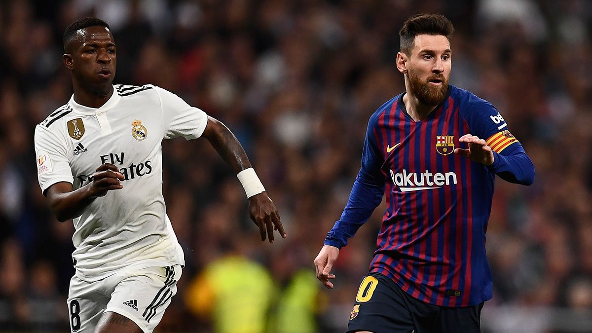 Vinicius Jr and Leo Messi in a match between FC Barcelona and Real Madrid