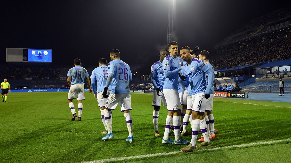 The players of Manchester City celebrate a goal in the Champions League