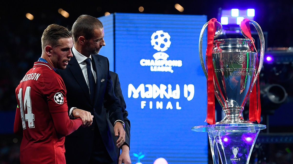 Aleksander Ceferin, president of UEFA, beside the Champions League trophy
