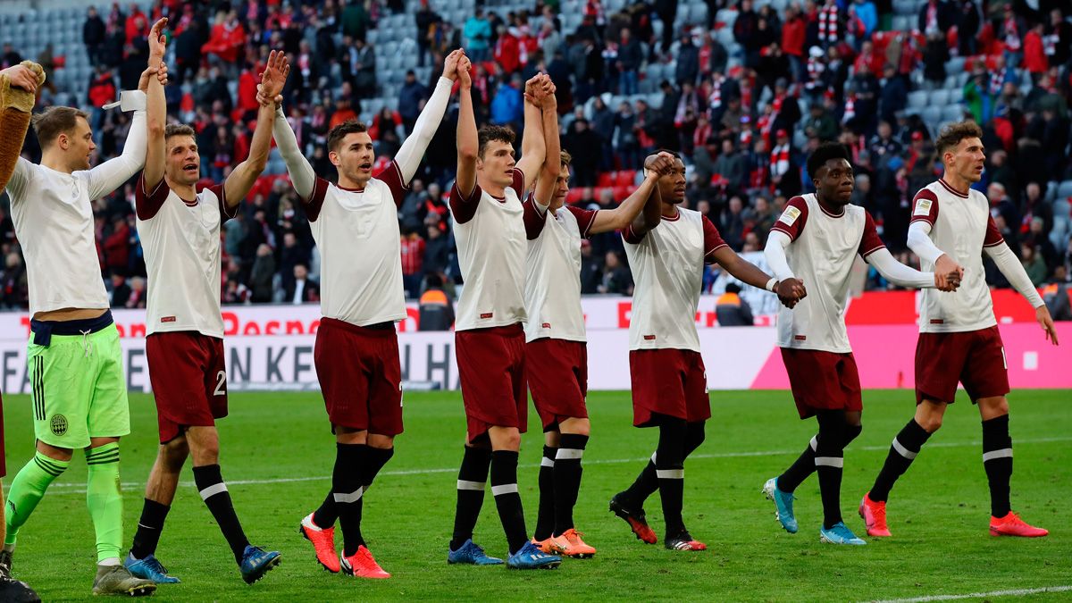 The players of Bayern Munich celebrate a victory in the Bundesliga