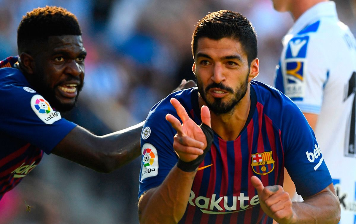 Umtiti and Luis Suárez, acting in front of the Mallorca