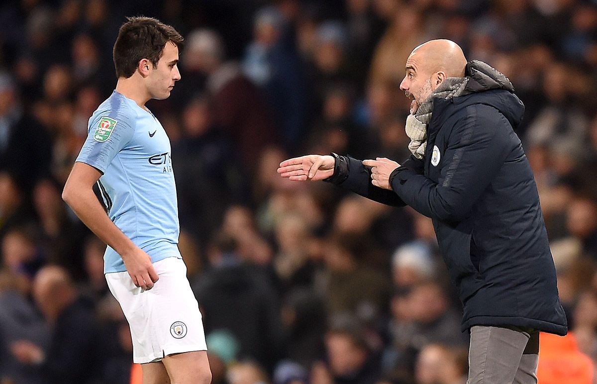 Eric García, beside Pep Guardiola