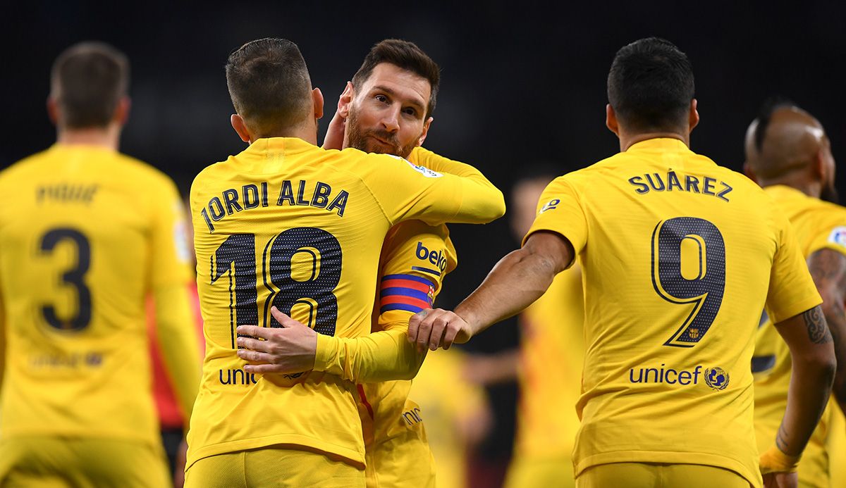 Leo Messi, celebrating a goal with Jordi Alba and Luis Suárez