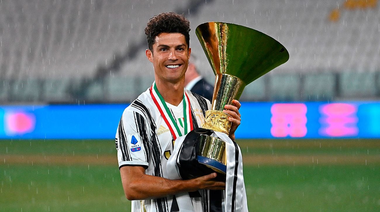 Cristiano Ronaldo, forward of the Juventus, poses with the trophy