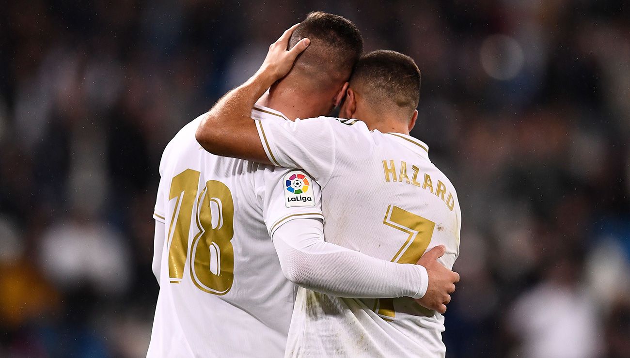 Hazard And Jovic embrace  celebrating a goal