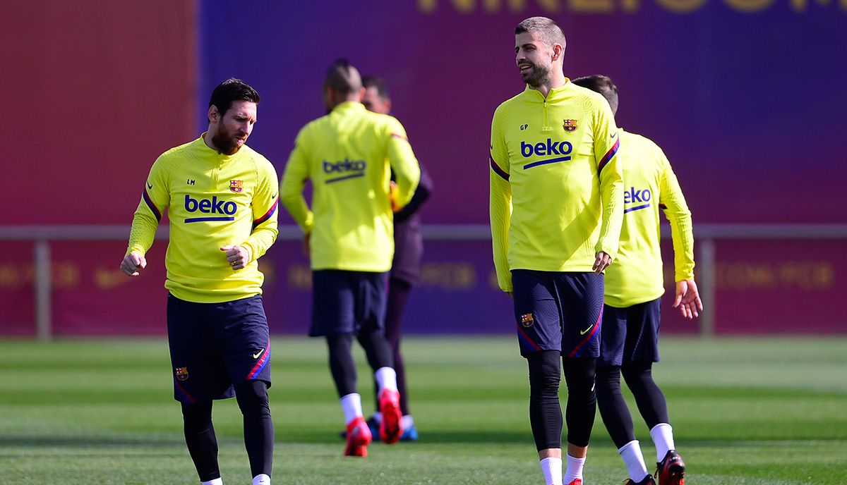 Leo Messi and Gerard Piqué, during a training with the Barça