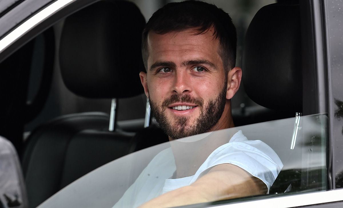 Miralem Pjanic, smiling from his Ferrari