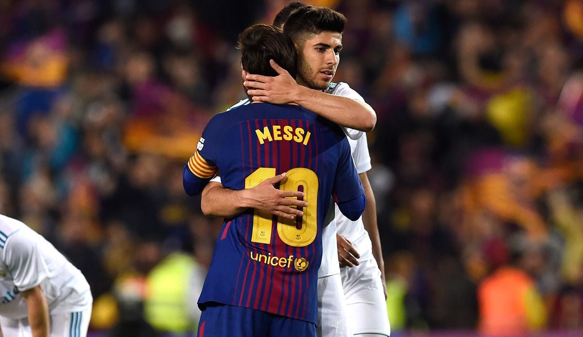 Marco Asensio and Leo Messi embrace  in a Classical
