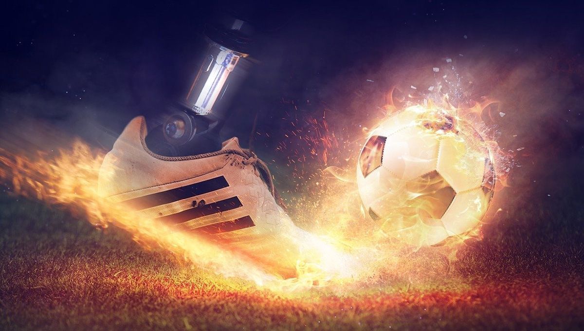 Setting of a mechanical boot kicking a ball in flames