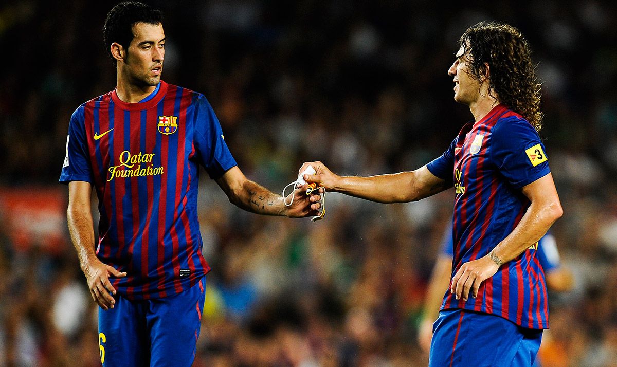 Sergio Busquets and Carles Puyol, during a match with the FC Barcelona