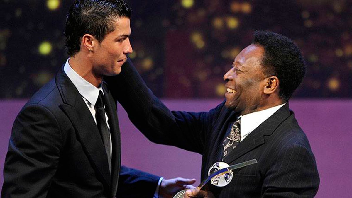 Cristiano Ronaldo, receiving a trophy from the hands of Pelé