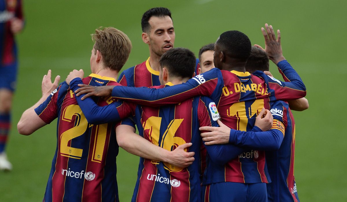 FC Barcelona's footballers celebrating a goal against Sevilla