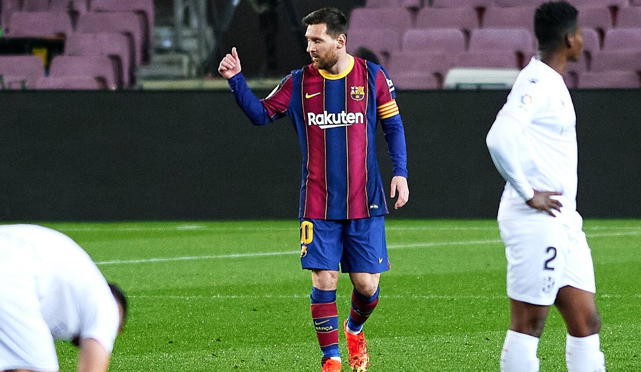 Leo Messi celebrates a goal in front of the Huesca