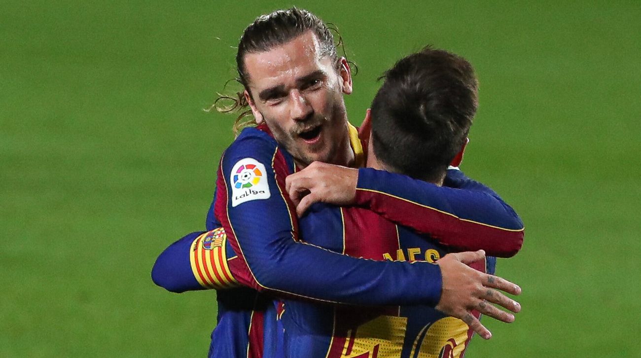 Antoine Griezmann celebrates his goal with Messi