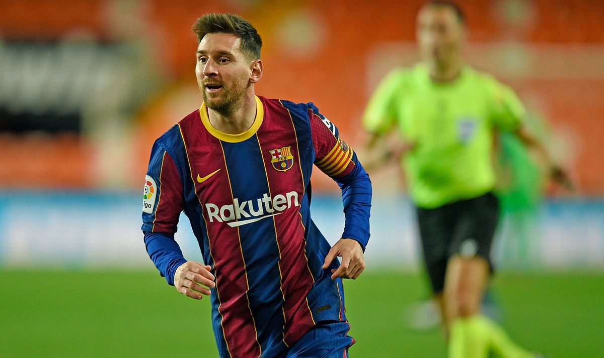 Messi, smiling after scoring a goal with the Barça