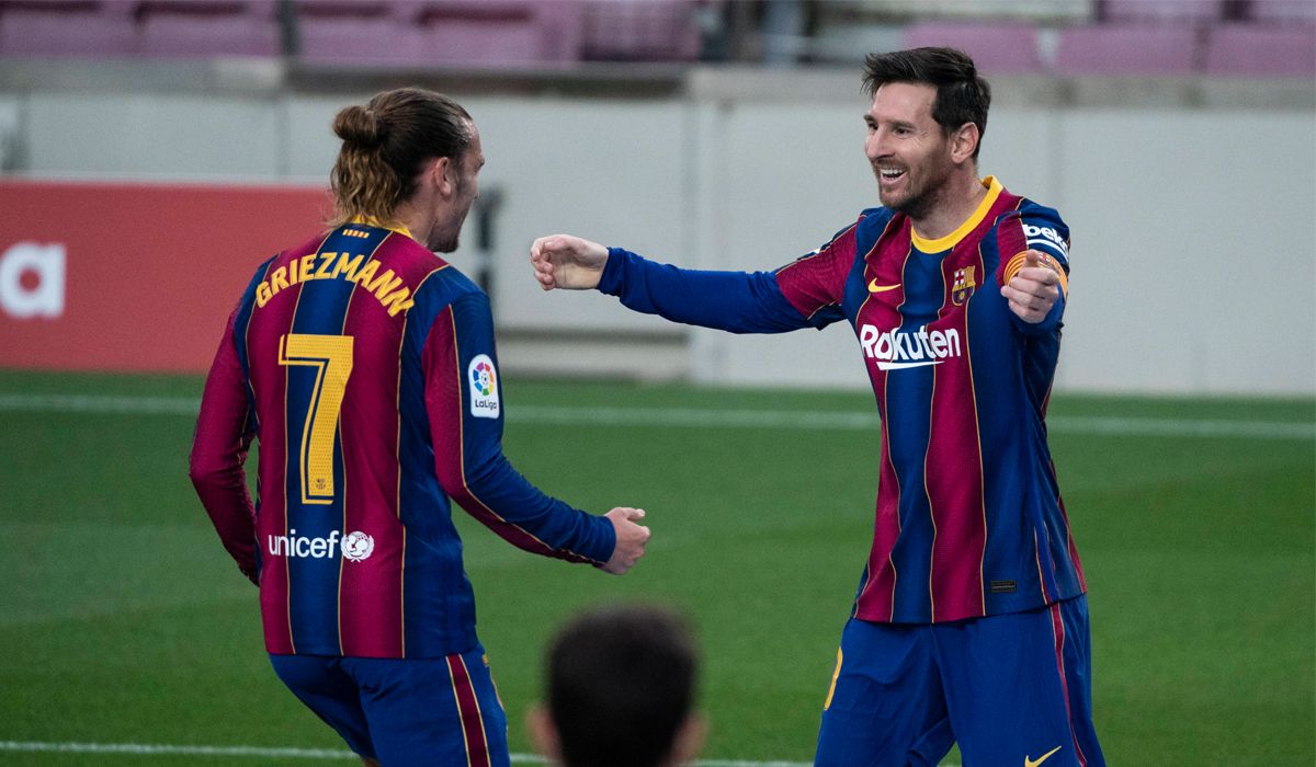 Leo Messi and Antoine Griezmann celebrate a goal with the Barça