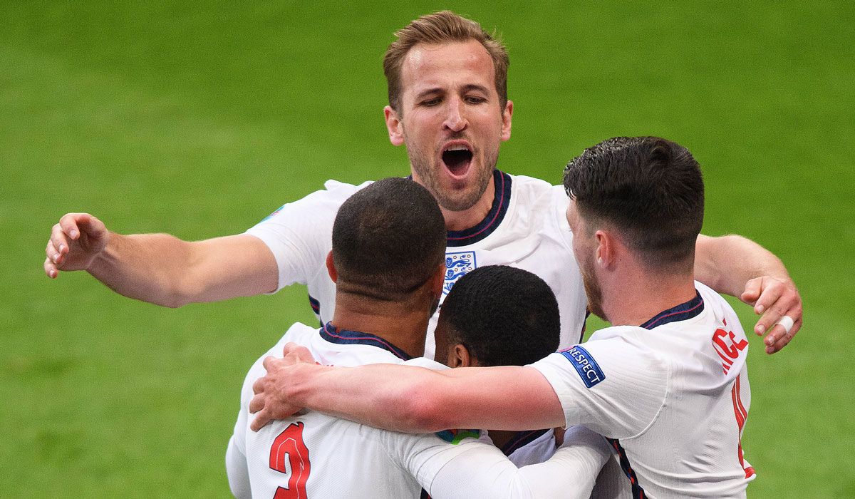 Harry Kane beside his mates of selection celebrating a goal