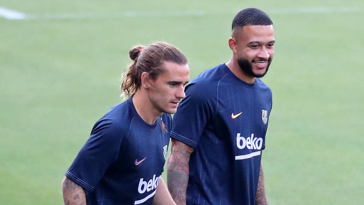 Memphis Depay y Antoine Griezmann, en un calentamiento con el Barça