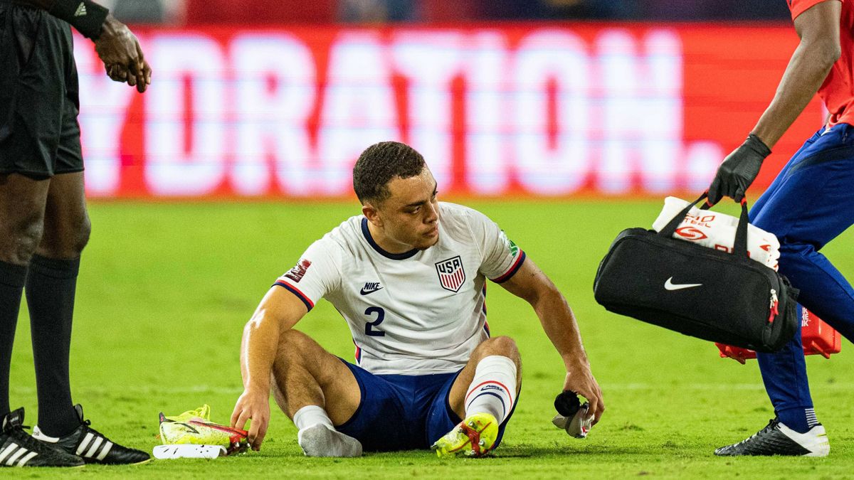 Sergiño Dest, being treated on the field during a United States game